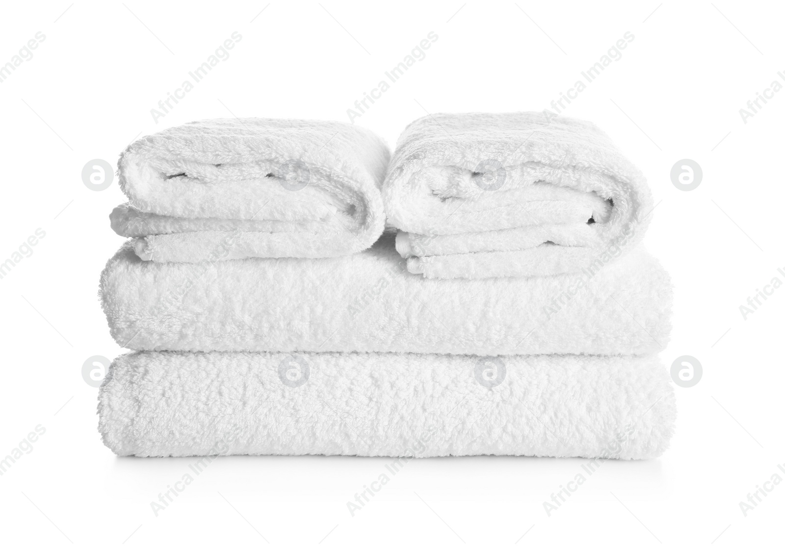 Photo of Stack of clean soft towels on white background