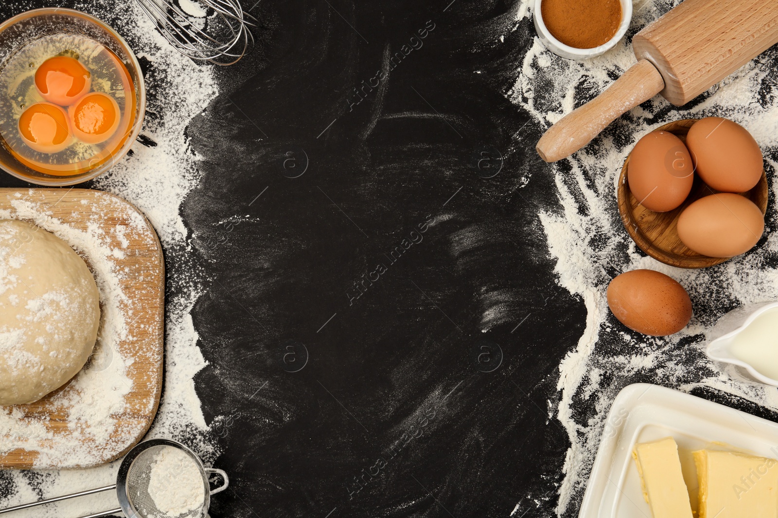 Photo of Flat lay composition with eggs and other ingredients on black table, space for text. Baking pie