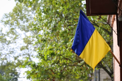 Photo of National flag of Ukraine on wall outdoors