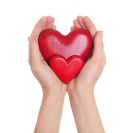 Photo of Woman holding decorative hearts in hands on white background, closeup