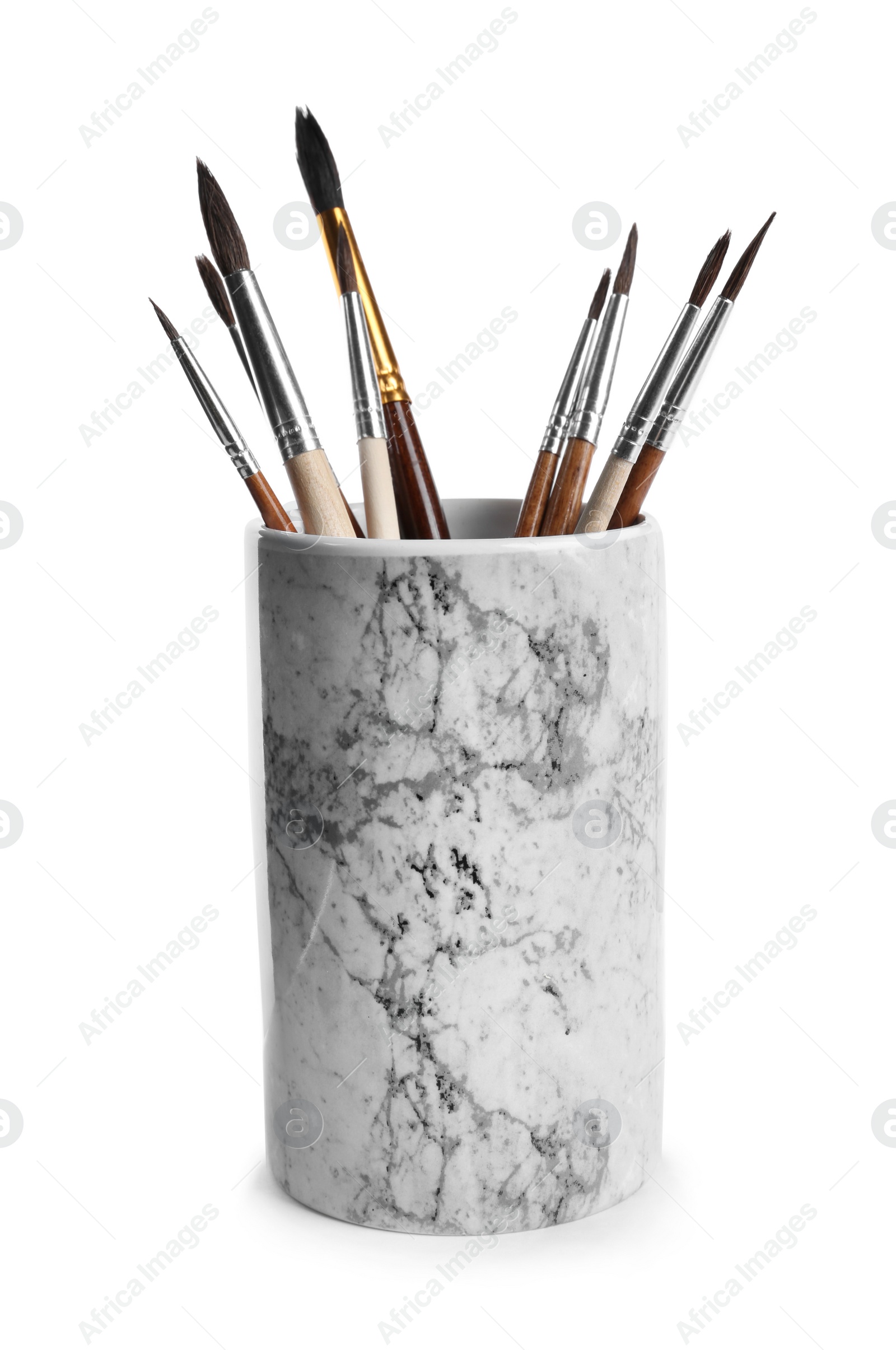 Photo of Holder with different paint brushes on white background