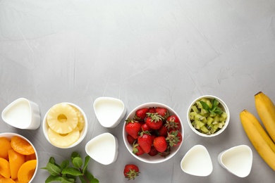 Photo of Flat lay composition with ingredients on grey background, space for text. Multi cooker yogurt recipe