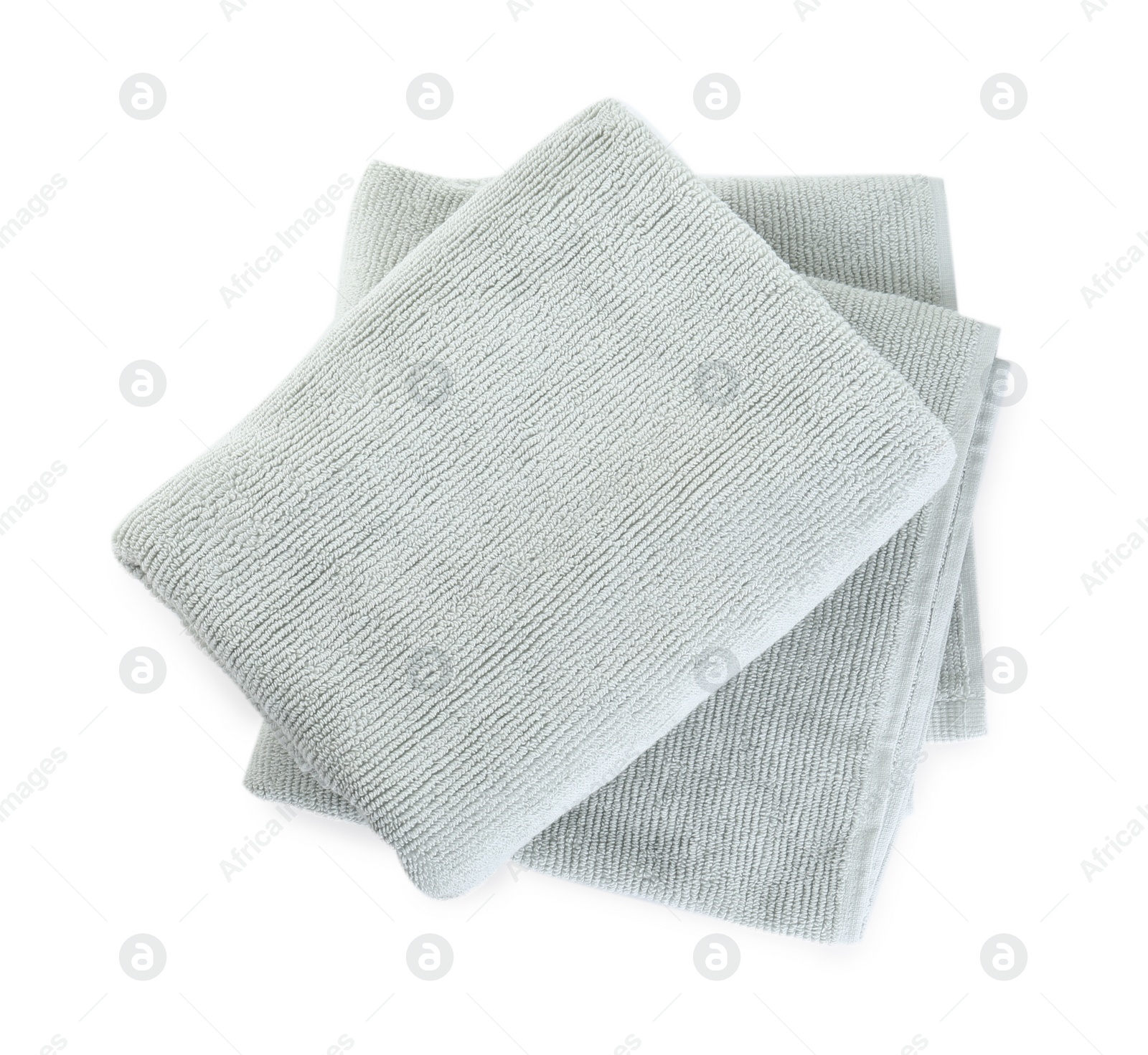 Photo of Soft folded towels isolated on white, top view