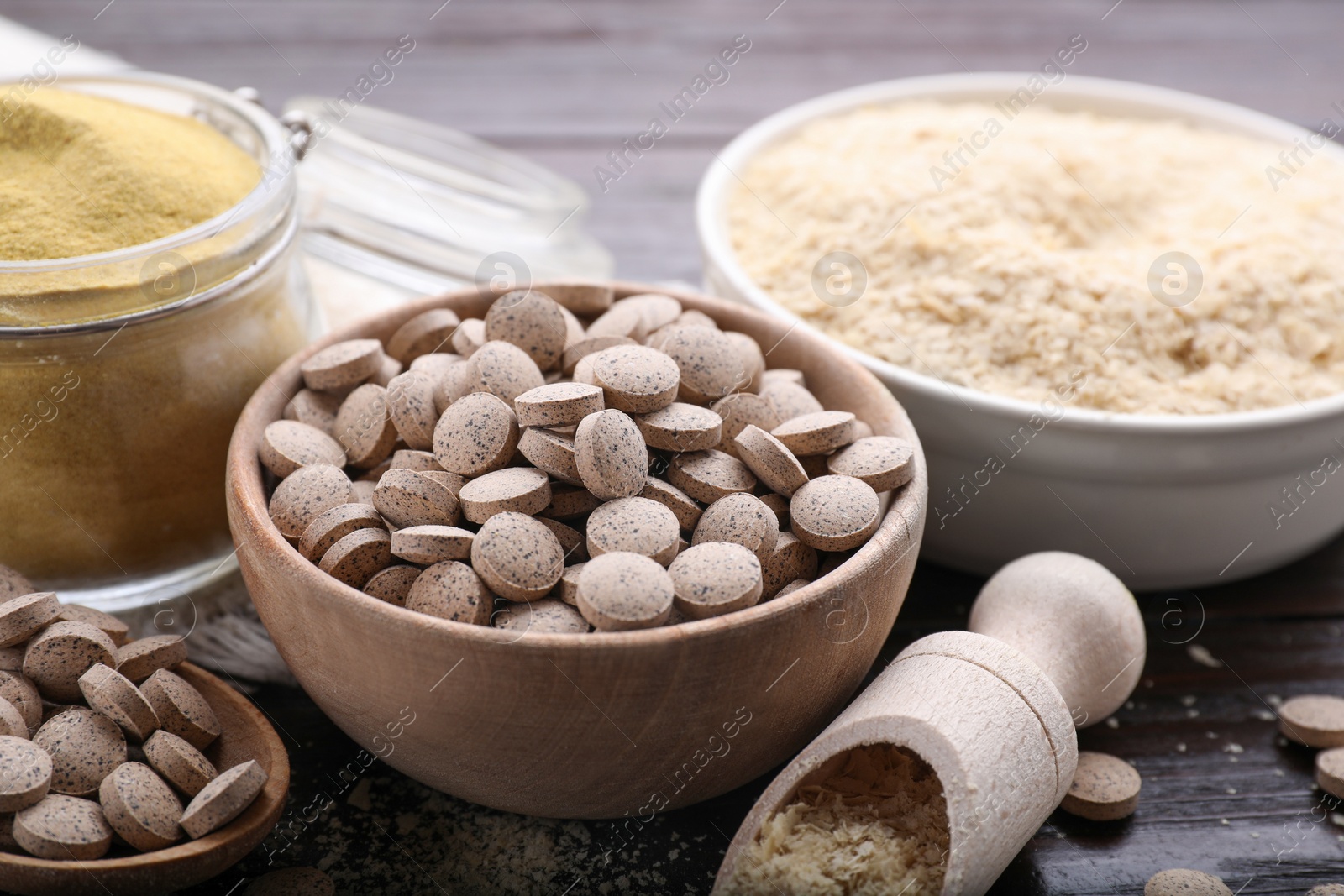 Photo of Different types of brewer`s yeast on wooden table