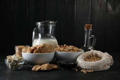 Different organic soy products on black table