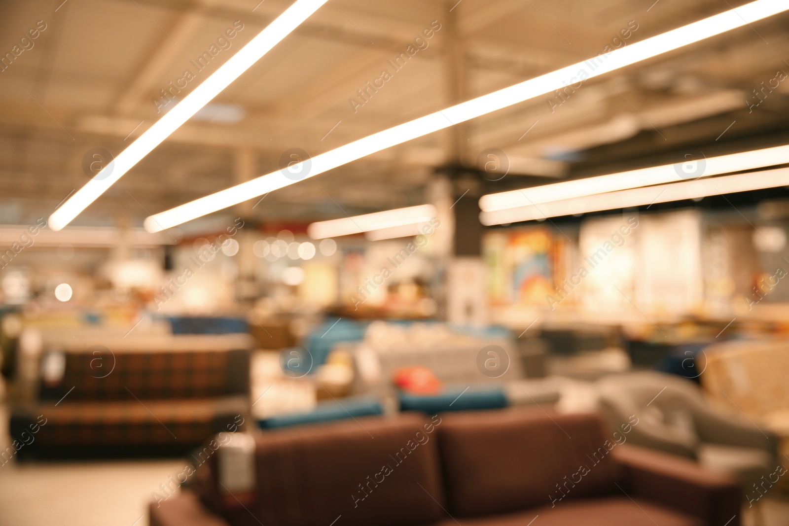 Photo of Blurred view of modern shopping mall interior