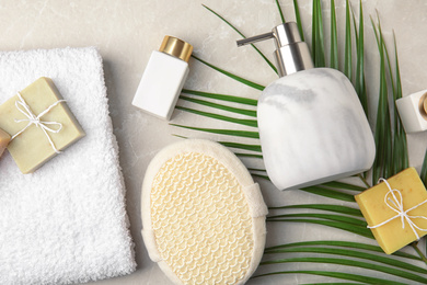 Photo of Flat lay composition with soap dispenser on marble background