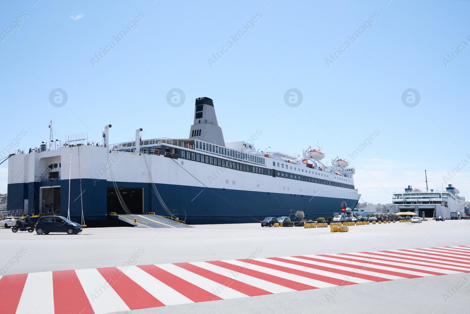 Photo of PIRAEUS, GREECE - MAY 19, 2022: Picturesque view of port with Blue Star ferry on sunny day