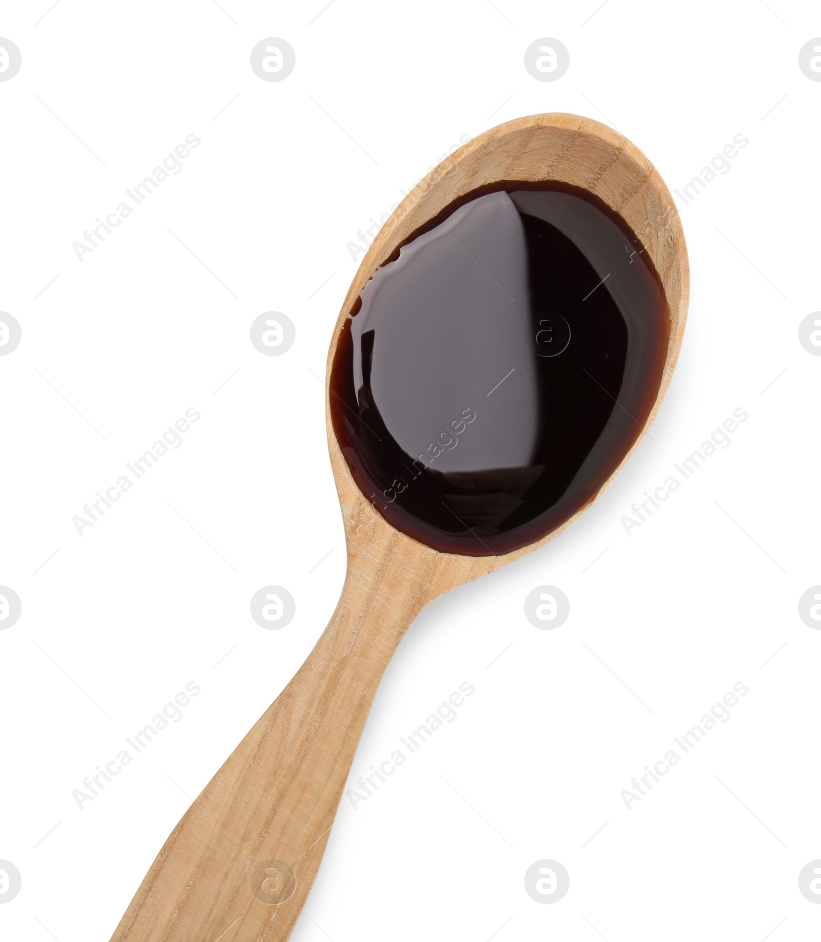 Photo of Tasty soy sauce in spoon isolated on white, top view