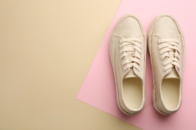 Photo of Pair of stylish comfortable shoes on color background, flat lay. Space for text