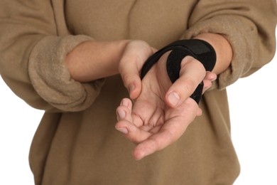 Woman with hand wrapped in medical bandage on white background, closeup