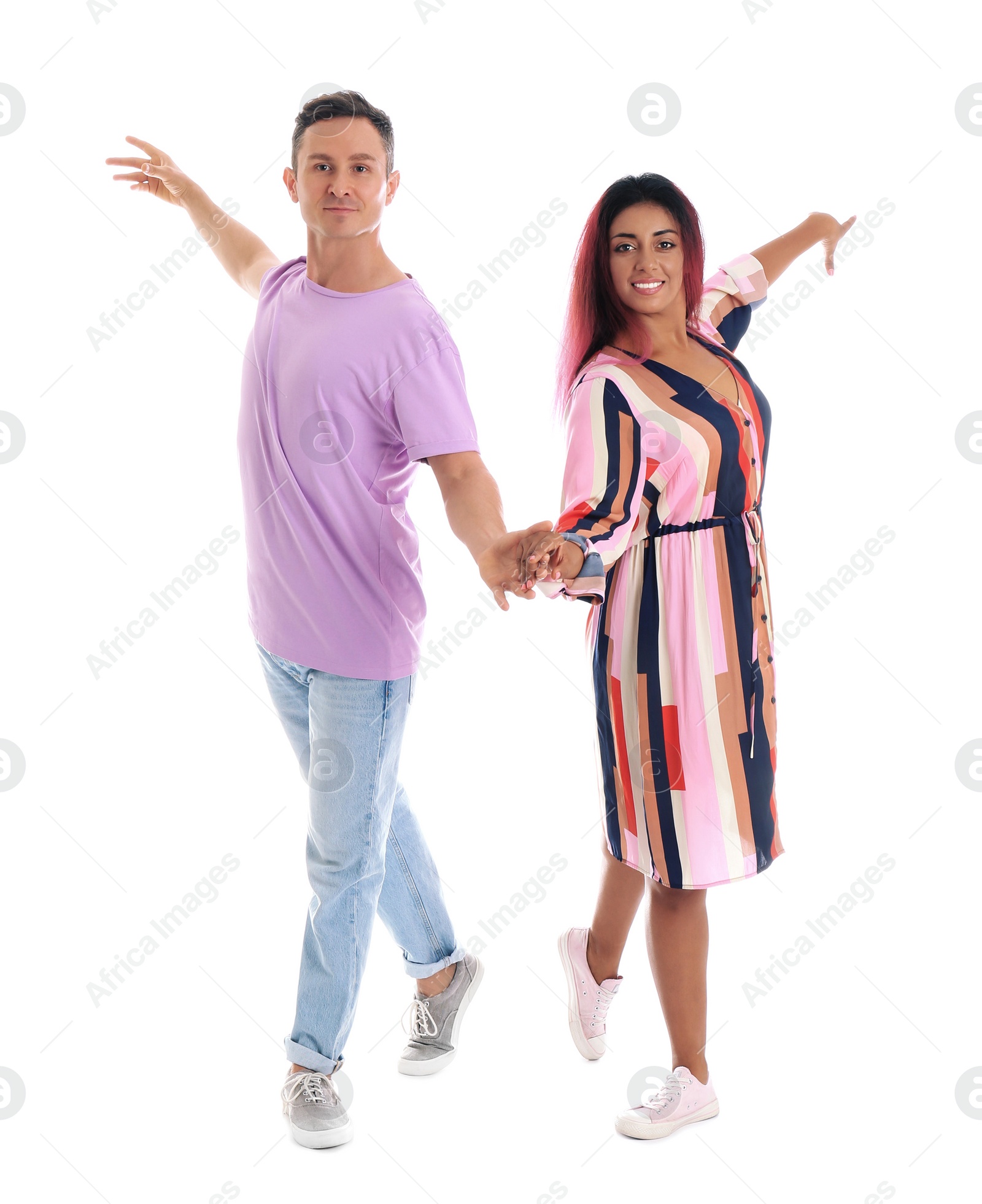 Photo of Beautiful lovely couple dancing on white background