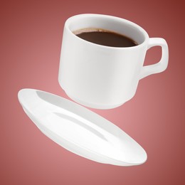 Image of White cup of coffee levitating on color background