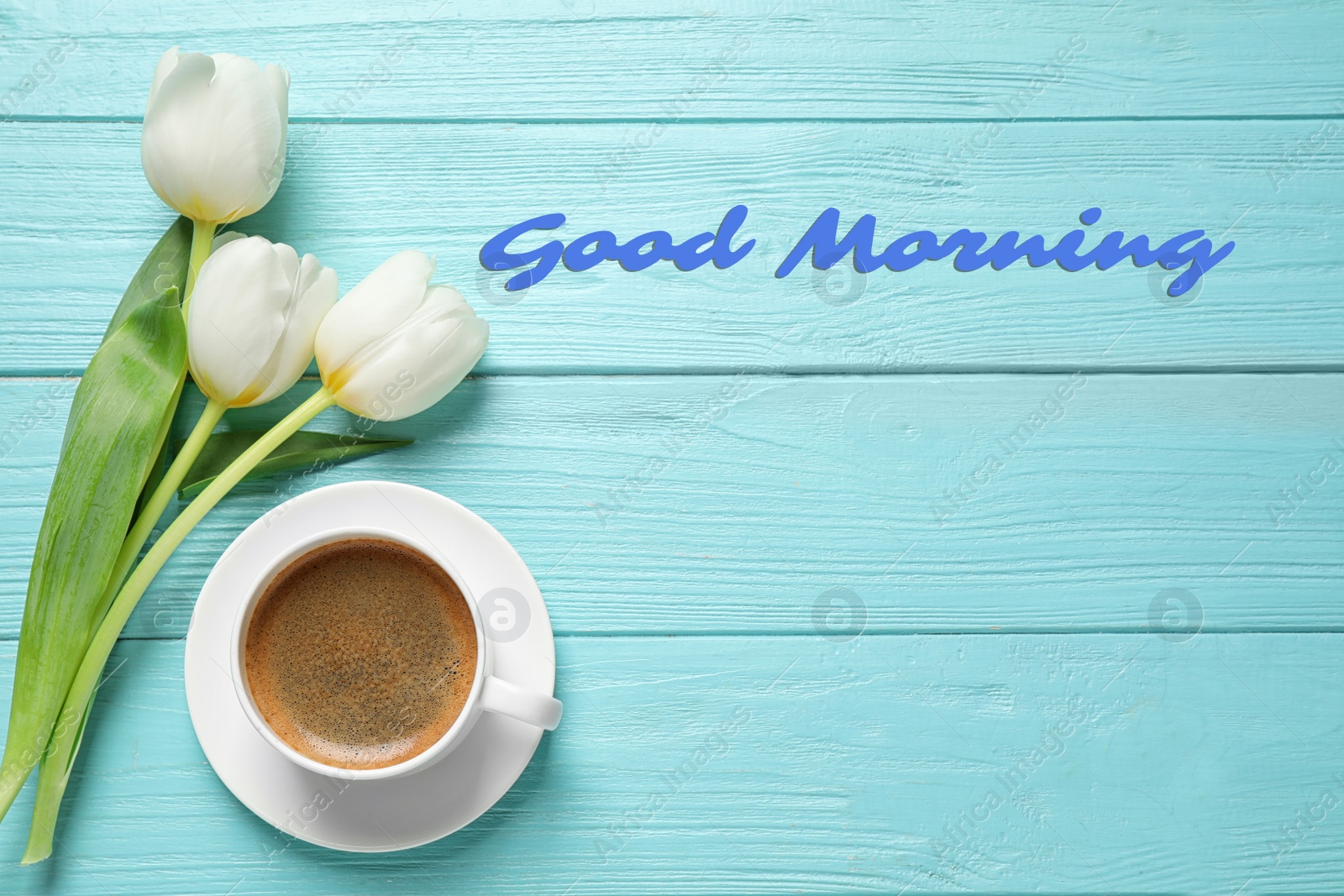 Image of White tulips and coffee on light blue wooden table, flat lay with space for text. Good morning