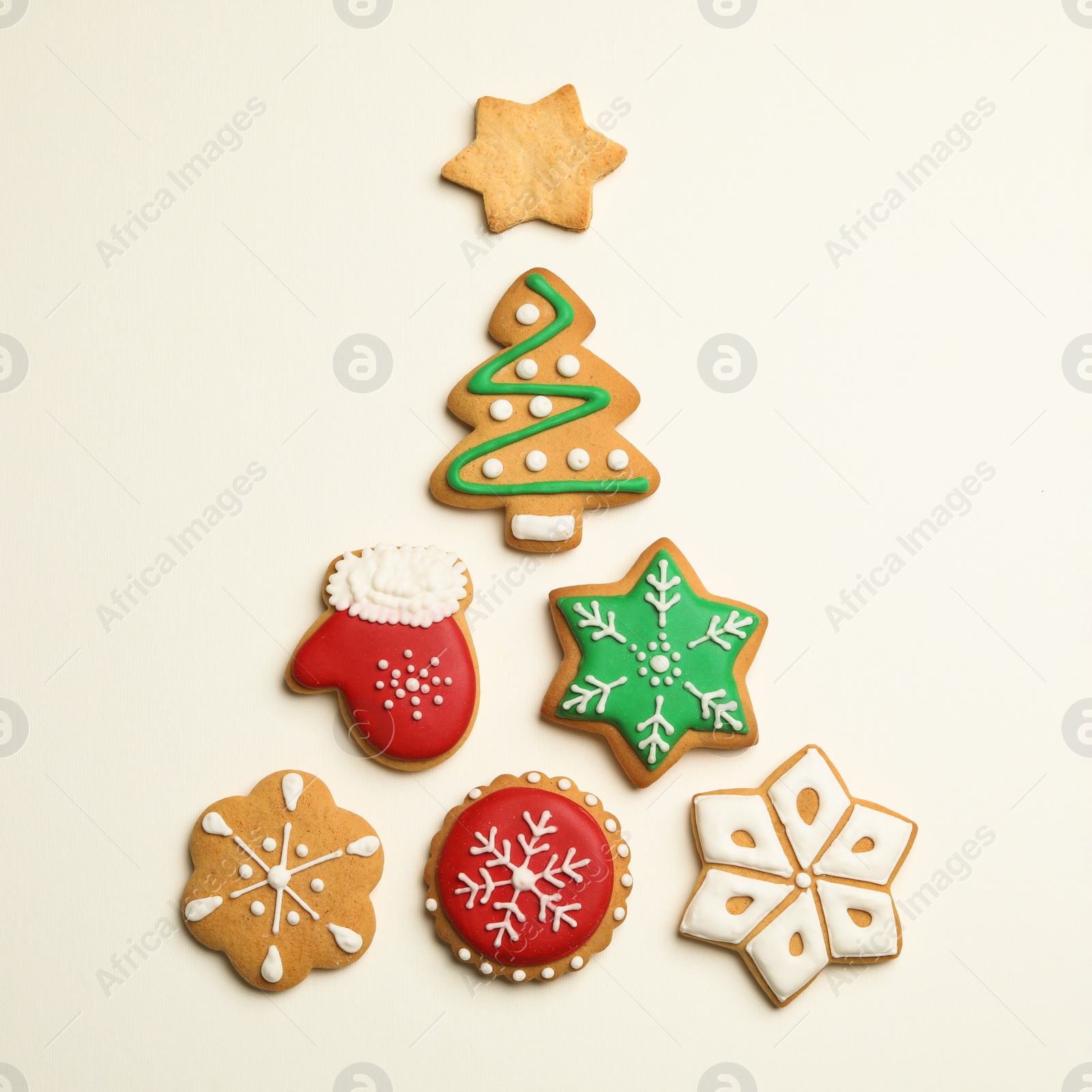 Photo of Flat lay composition with Christmas tree made of cookies on light background