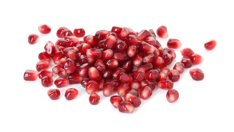 Photo of Pile of tasty pomegranate grains isolated on white