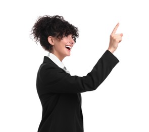 Beautiful happy businesswoman pointing at something on white background