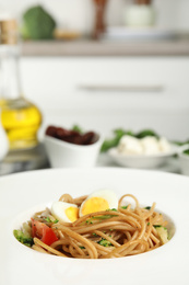 Tasty buckwheat noodles in plate on table, closeup