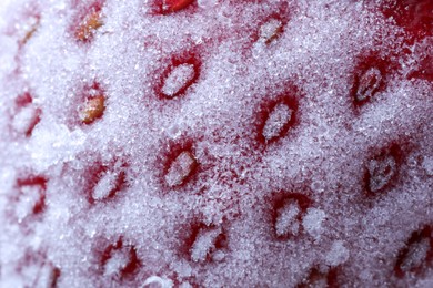 Photo of Texture of frozen ripe strawberry, macro view