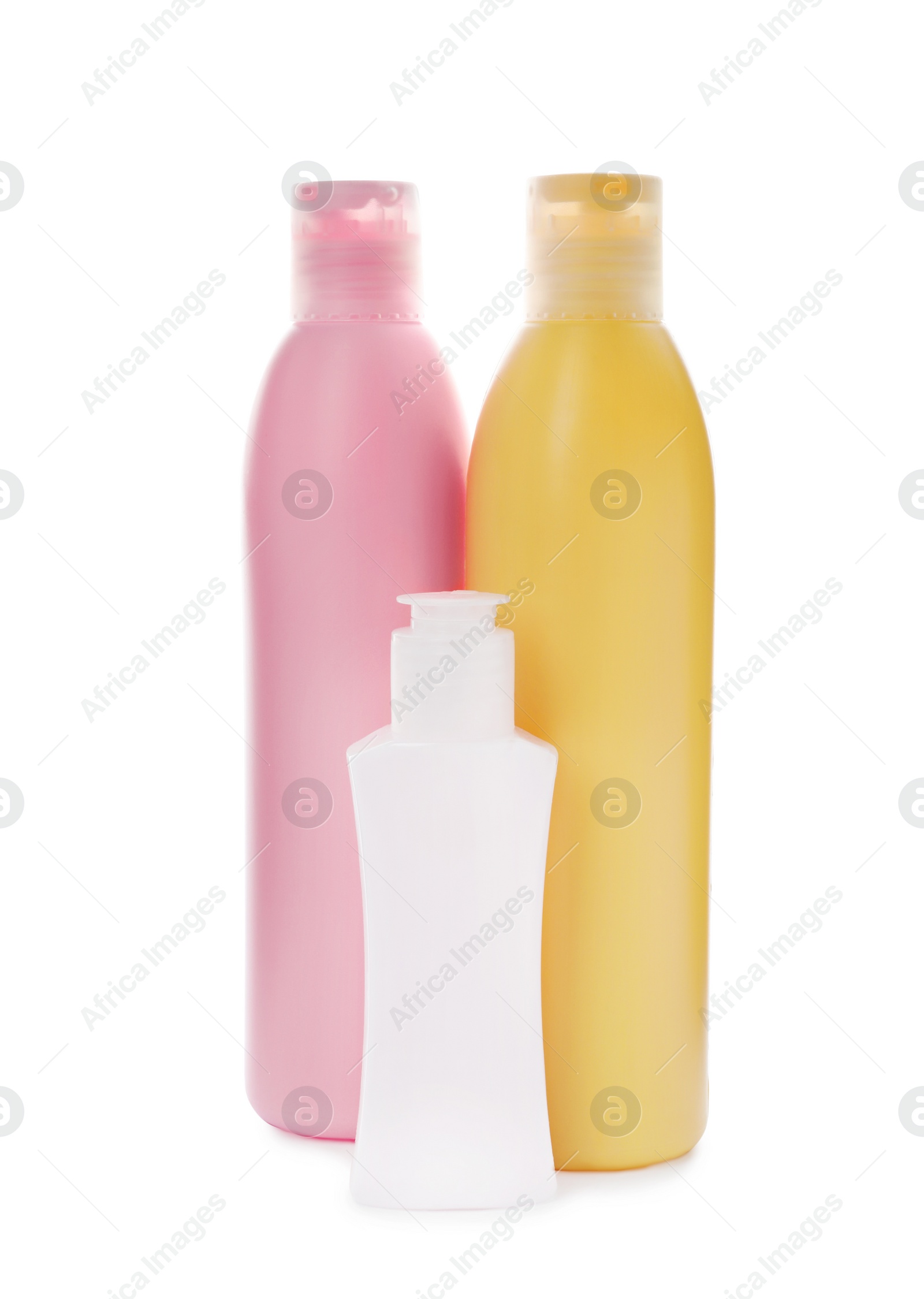 Photo of Bottles with cosmetic products on white background. Mockup for design