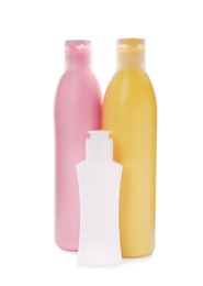 Photo of Bottles with cosmetic products on white background. Mockup for design