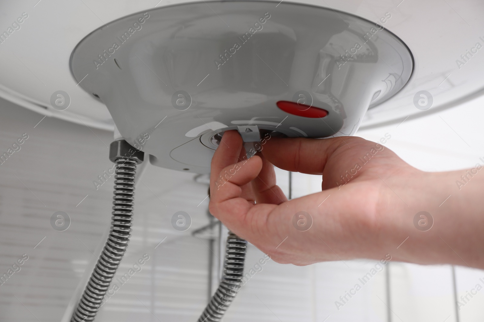 Photo of Woman adjusting maximum energy efficiency indicator indoors, closeup. Boiler installation