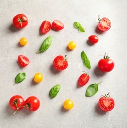 Photo of Flat lay composition with cherry tomatoes on light background