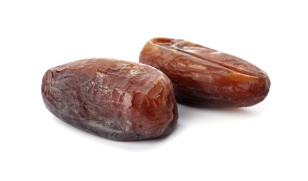 Photo of Sweet dates on white background. Dried fruit as healthy snack