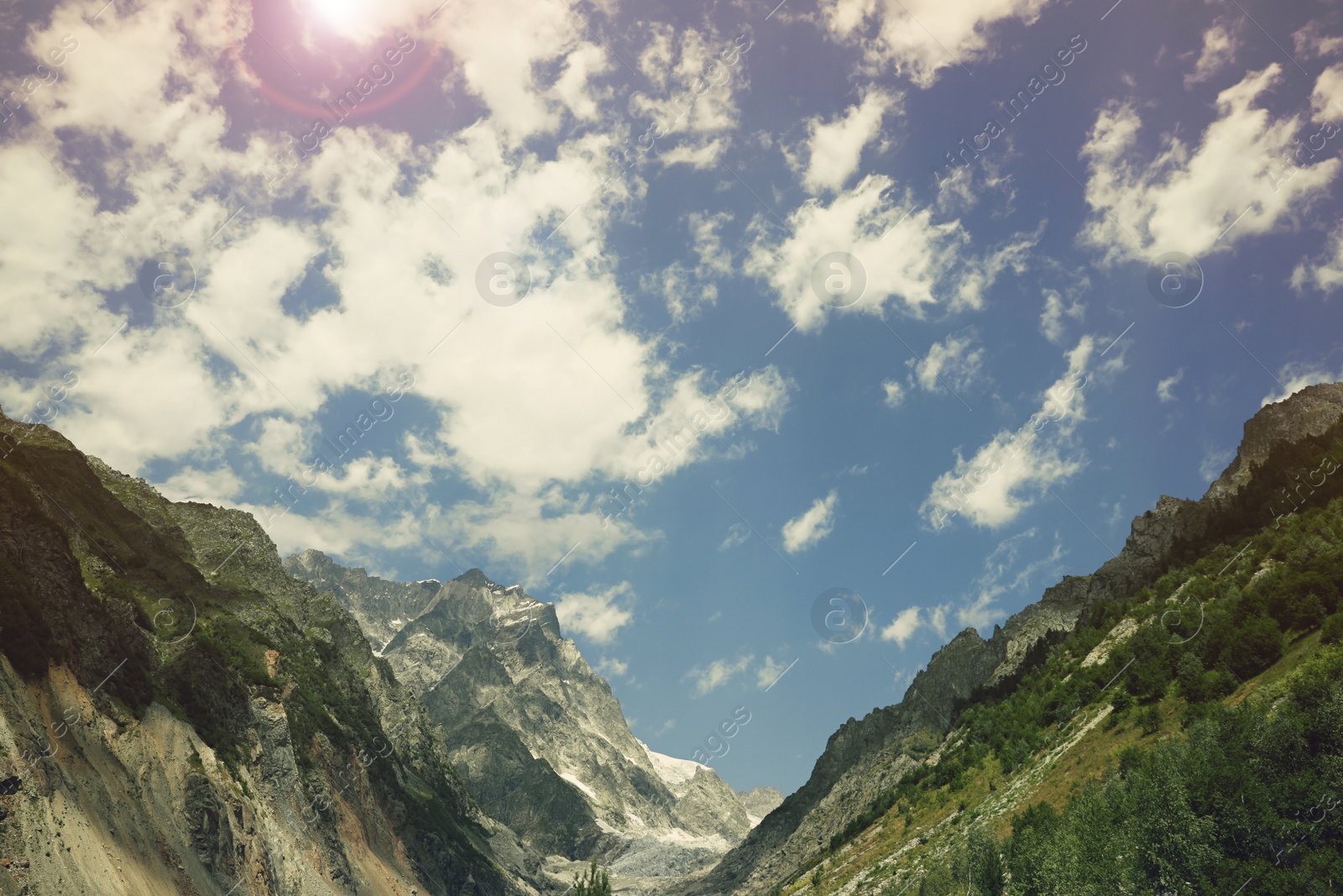 Photo of Picturesque view of mountains under cloudy sky