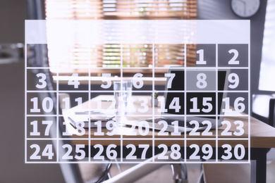 Image of Calendar and office interior with wooden table