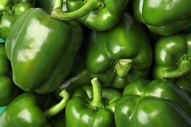 Photo of Ripe green bell peppers as background, top view