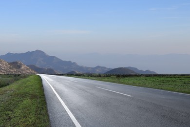 Empty asphalt road in mountains. Picturesque landscape