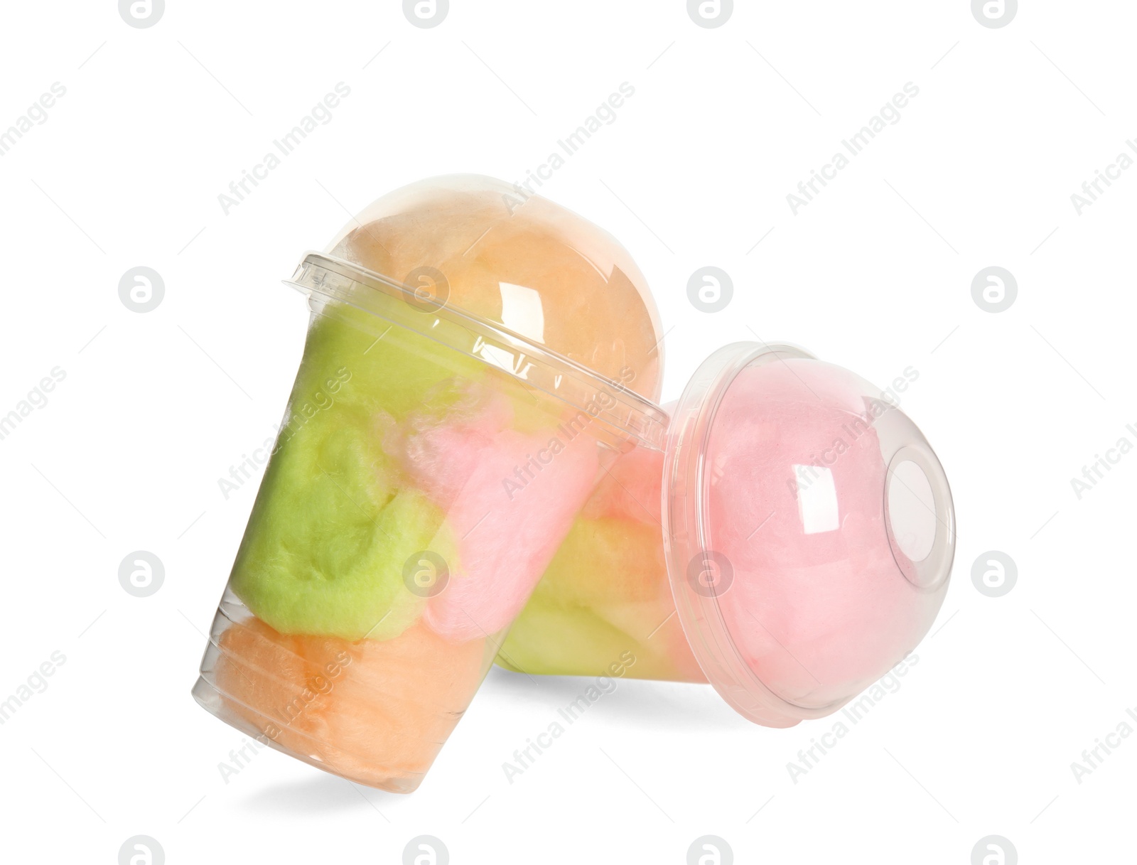 Photo of Plastic cups with tasty cotton candies on white background