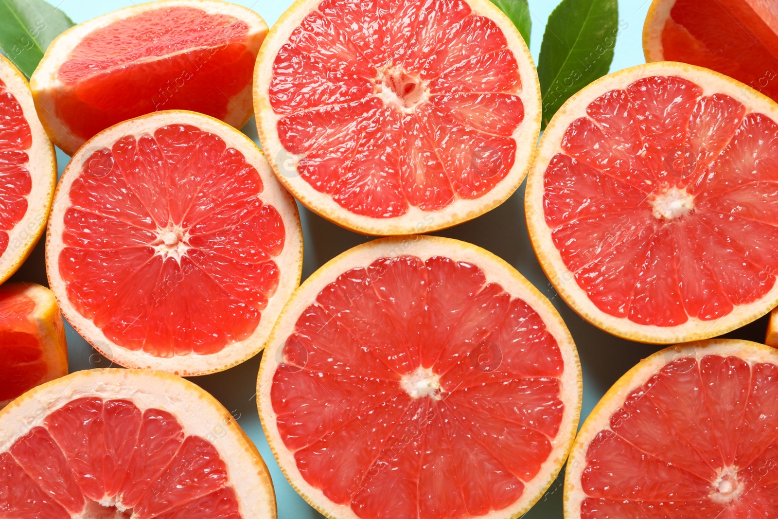 Photo of Fresh grapefruits on color background, flat lay. Citrus fruits