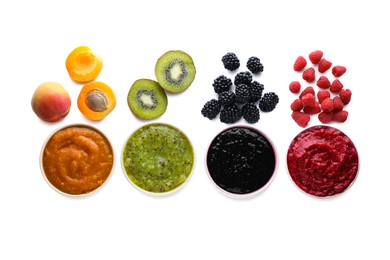 Different puree in bowls and fresh ingredients on white background, top view