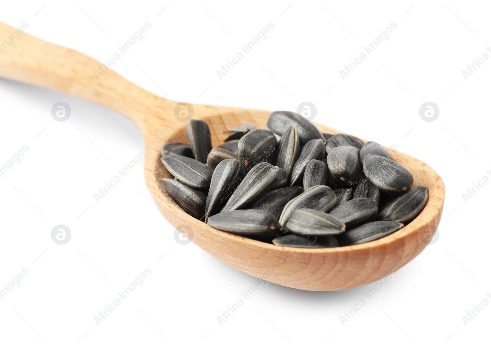 Photo of Raw organic sunflower seeds in wooden spoon isolated on white