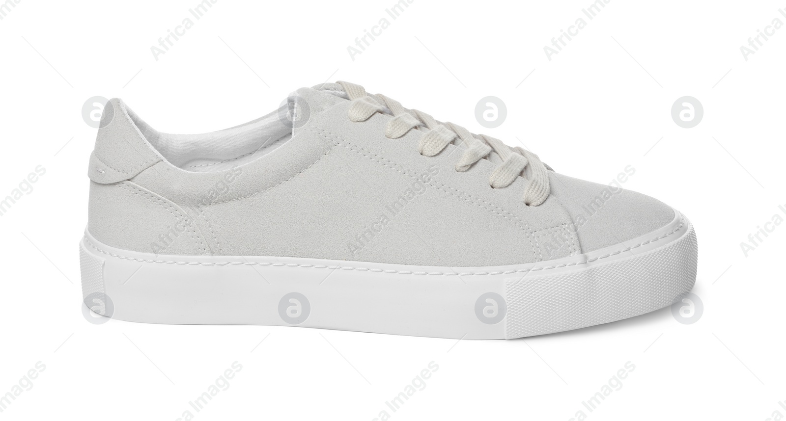 Photo of One stylish beige sneaker isolated on white