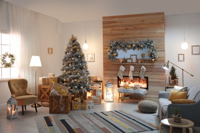 Photo of Beautiful living room interior with decorated Christmas tree and fireplace