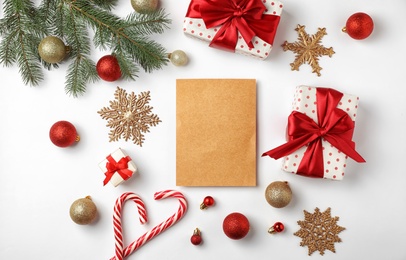 Flat lay composition with empty card and Christmas decoration on white background. Writing letter to Santa Claus