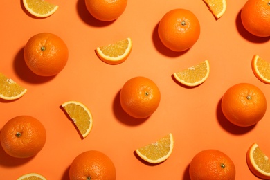 Flat lay composition with fresh ripe oranges on color background