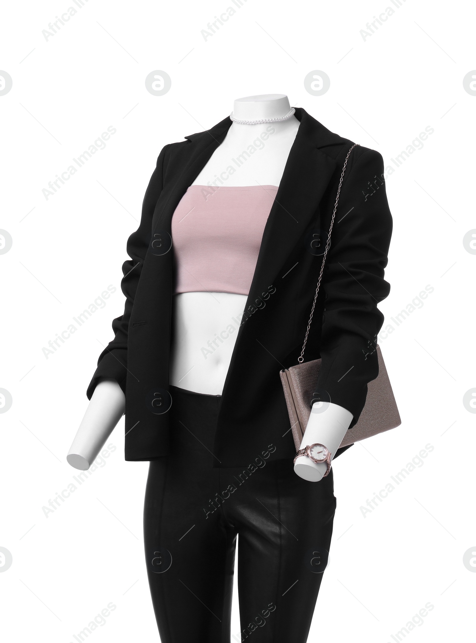 Photo of Female mannequin dressed in black suit and crop top with accessories isolated on white. Stylish outfit