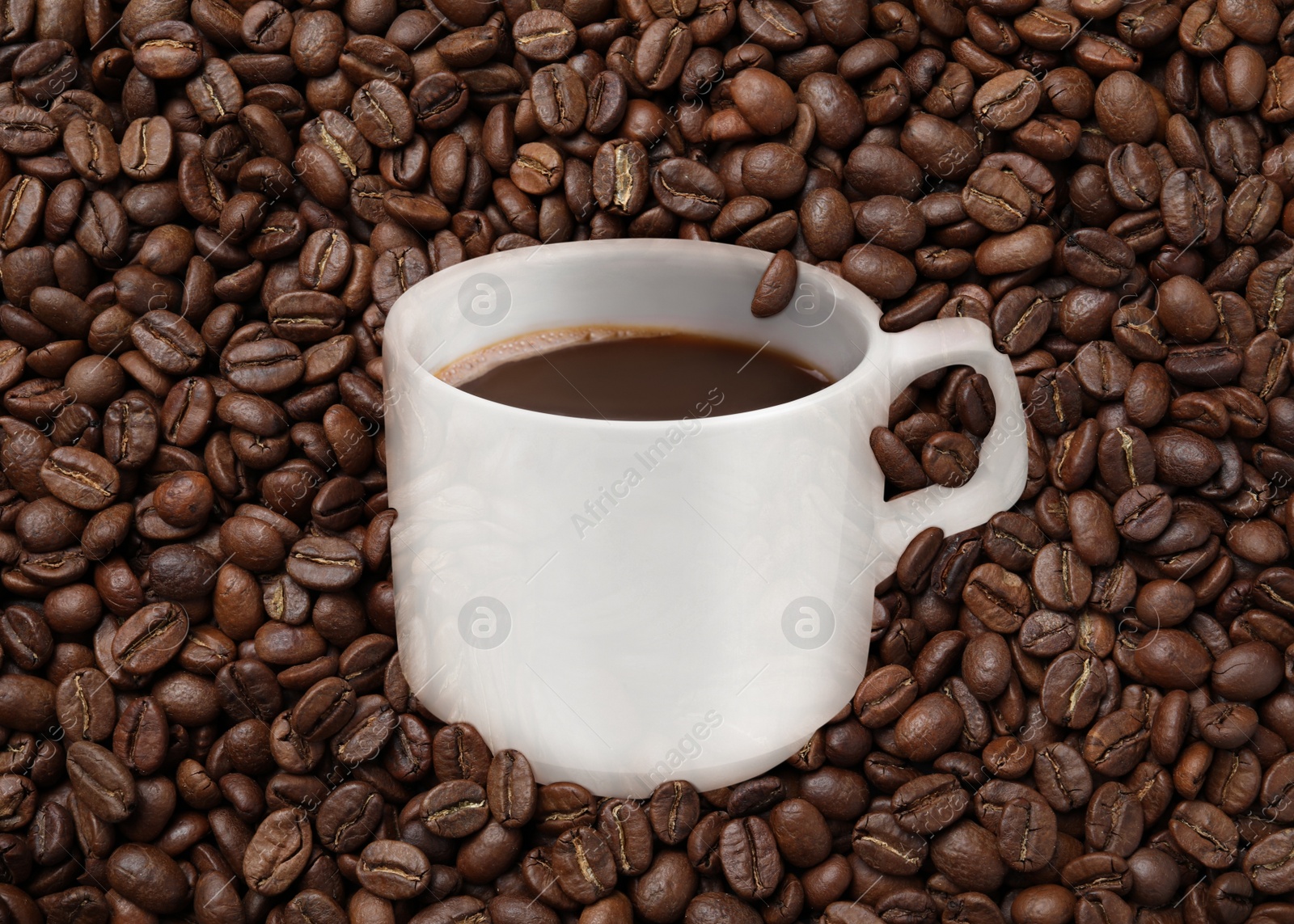 Image of Cup of tasty espresso and roasted coffee beans