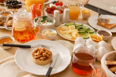 Photo of Dishes with different food on table. Luxury brunch