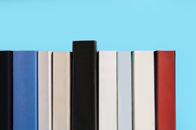 Collection of books on light blue background