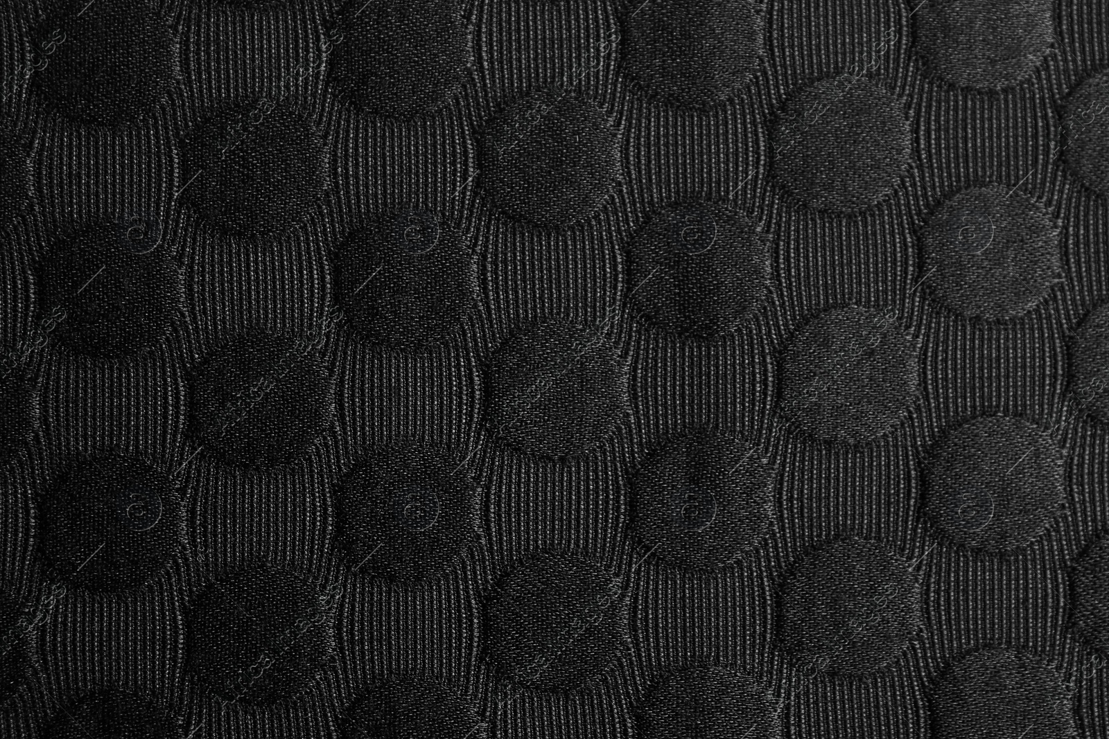 Photo of Textured black fabric as background, closeup view