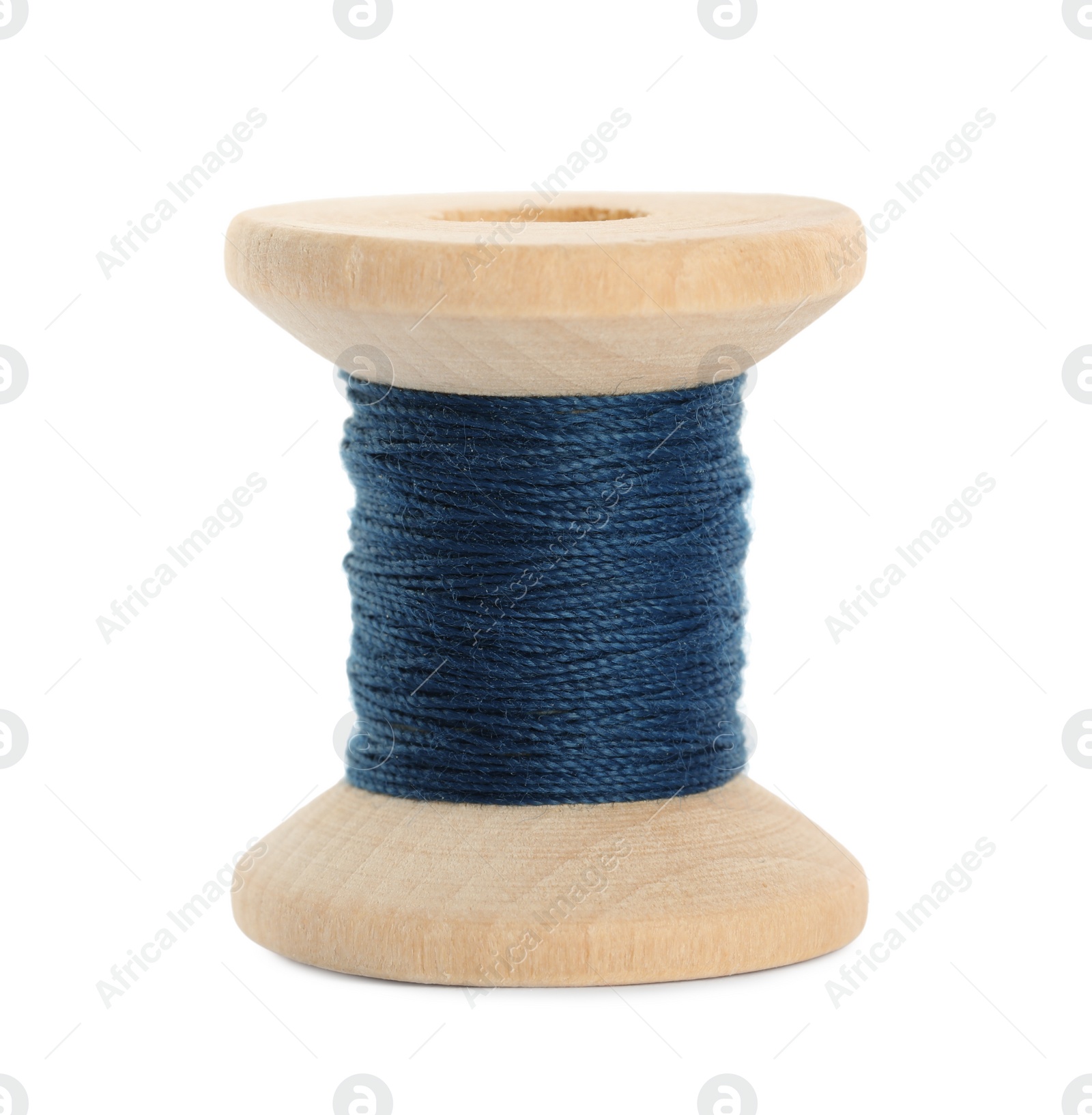 Photo of Wooden spool of dark blue sewing thread isolated on white