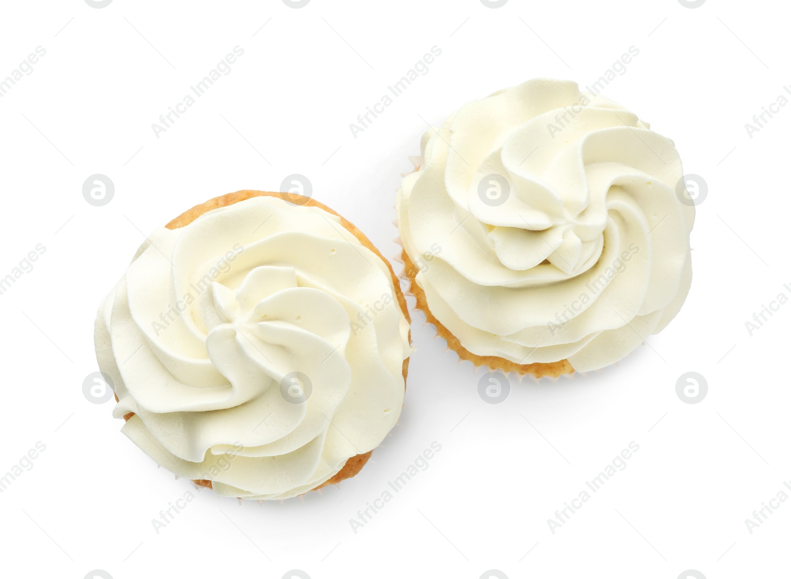 Photo of Tasty vanilla cupcakes with cream isolated on white, top view