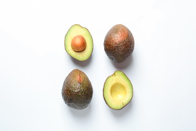 Composition with ripe fresh avocados on white background