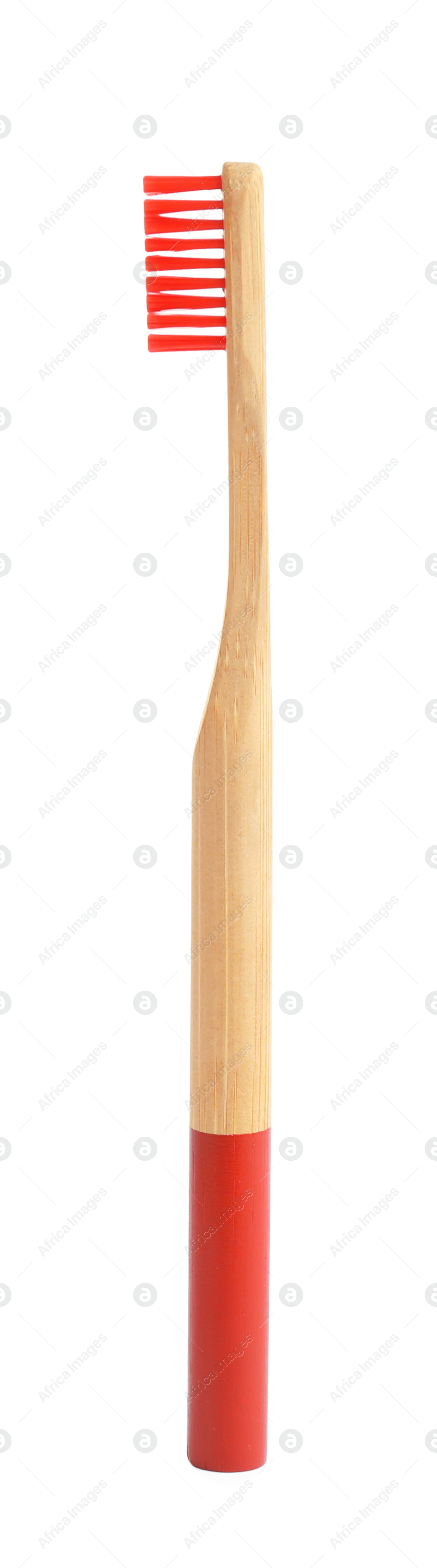 Photo of Bamboo toothbrush with red bristle isolated on white