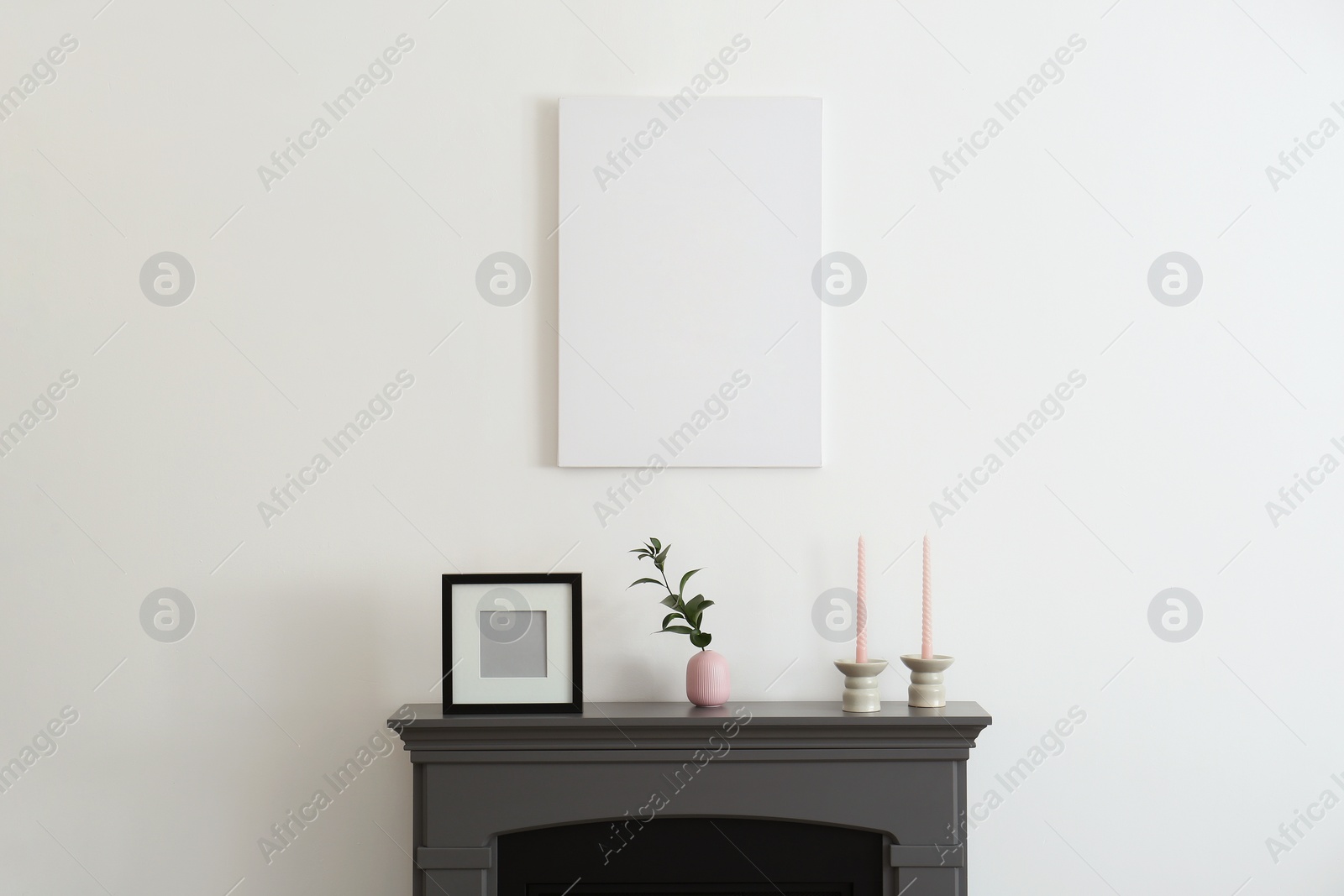 Photo of Room interior with fireplace, decorative elements and poster